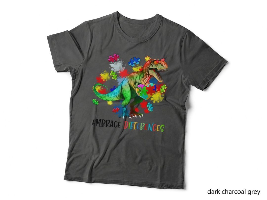 Embrace Differences Autism T-Shirt, Colorful T-Rex Holding Heart Puzzle Graphic