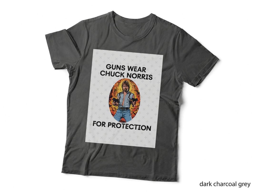 Guns Wear Chuck Norris... Essential T-Shirt
